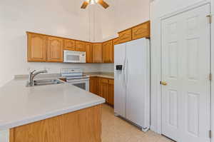 Kitchen and Pantry featuring Corian Counters and Flat Top Stove