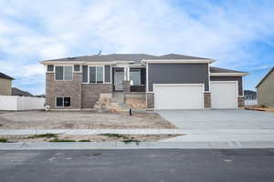 View of front of home featuring a garage