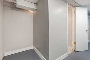 Hallway with concrete flooring