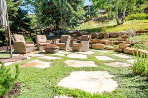 View of yard with a patio and a fire pit