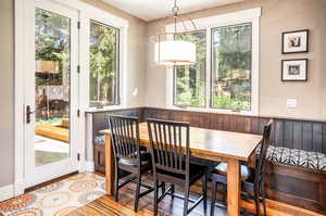 Dining room with light hardwood / wood-style flooring