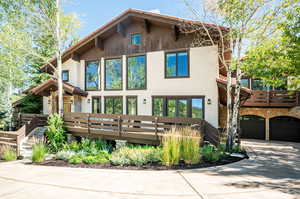 Rear view of property with a garage