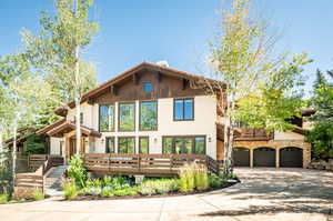 View of front of property with a wooden deck