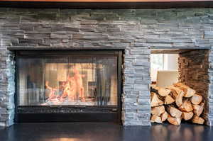 Room details featuring a stone fireplace