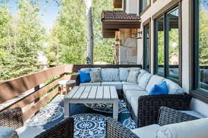 View of patio with an outdoor hangout area