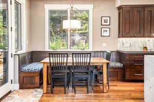 Dining space featuring light hardwood / wood-style floors and a healthy amount of sunlight