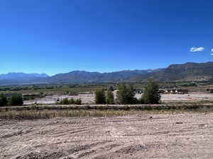 Property view of mountains with a rural view