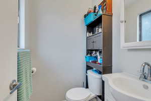 Bathroom featuring toilet and vanity