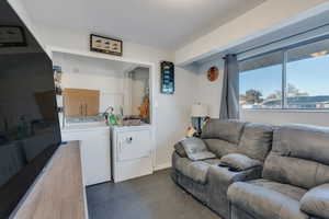 Living room featuring separate washer and dryer