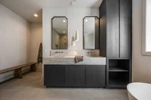 Bathroom with tile patterned flooring and vanity