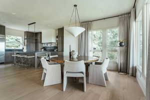 Dining room featuring sink and light wood-type flooring