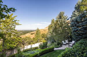 View of yard featuring a mountain view and a patio area