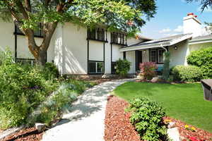 View of front of house featuring a front lawn