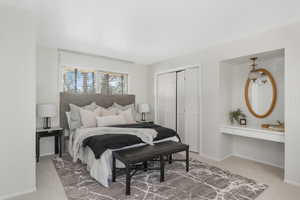 Bedroom 1 with bathroom. Carpeted with a closet