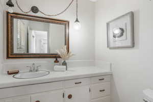 Bathroom featuring toilet and vanity