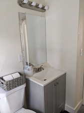 Bathroom featuring vanity and toilet