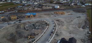Aerial overview of property's location with nearby suburban area