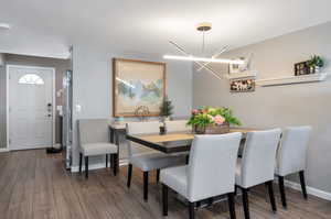 Dining area with an inviting chandelier