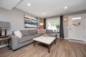 Living room featuring new vinyl flooring and fresh paint