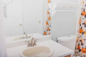 Bathroom with toilet and vanity