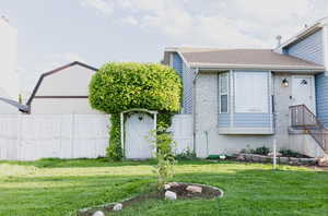 View of front of house with a front yard