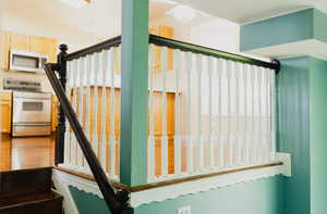 Stairway with hardwood / wood-style floors