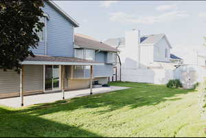 View of yard featuring a patio area and a shed