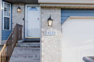 Property entrance featuring a garage