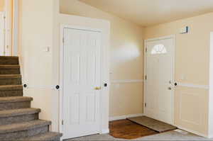 View of carpeted entrance foyer