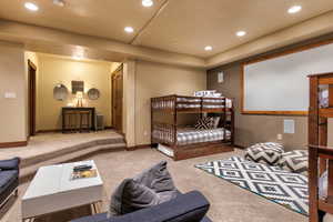 Carpeted bedroom with radiator