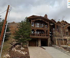 Rear view of house with a garage