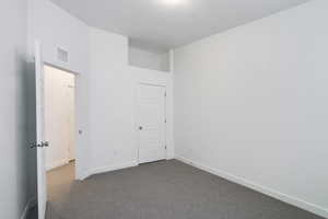 Unfurnished bedroom featuring carpet flooring