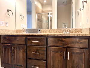 Primary bathroom featuring vanity and walk in shower