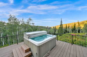 Wooden deck with a hot tub