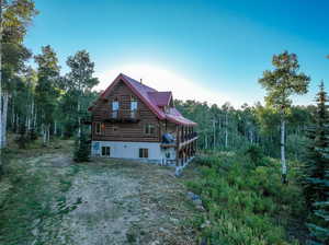 View of home's exterior featuring a balcony