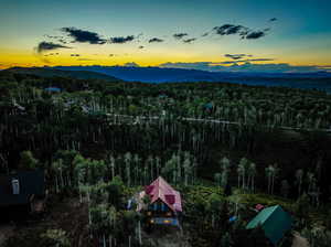 Aerial view at dusk featuring a mountain view