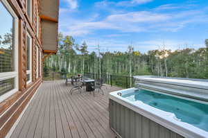 Deck featuring a hot tub