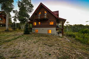 Back of house featuring a balcony