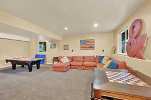 Living room with carpet and billiards