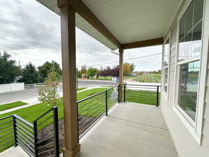 Covered porch with a yard
