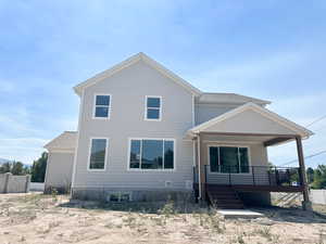 View of front of home with covered porch and stairs