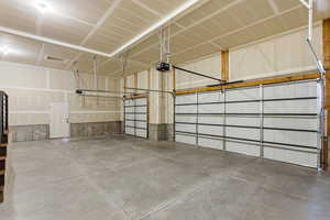 Garage featuring a garage door opener