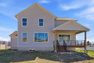 Traditional home featuring covered porch