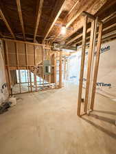 Unfinished basement with electric panel