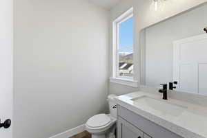 Bathroom with vanity and toilet