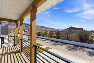 Balcony featuring a mountain view and a residential view