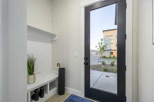 Mudroom featuring light wood-type flooring and a wealth of natural light