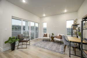 Living area with light hardwood / wood-style floors