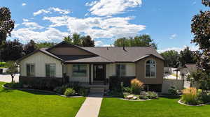 View of front of property featuring a front lawn