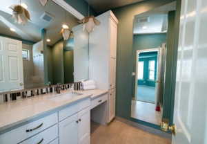 Bathroom with ceiling fan, tile patterned flooring, and vanity